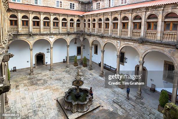 Tourists photographing in Parador Hostal de Los Reyes Catolicos, Santiago de Compostela, Galicia, Spain.