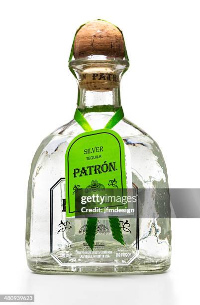 silver patron tequila bottle with tag - lechuguilla cactus stock pictures, royalty-free photos & images