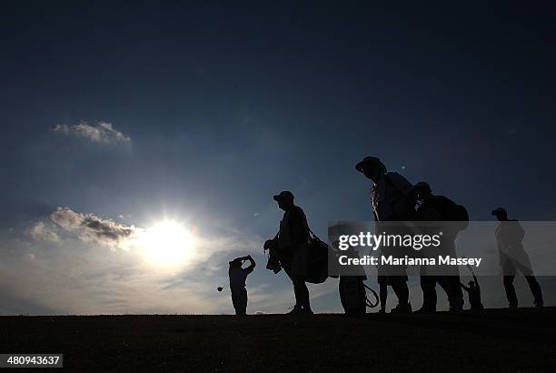 Golfers from the group Woody Austin, Johnson Wagner and Harrison Frazar tee off on the 11th during Round One of the Valero Texas Open at the AT&T...