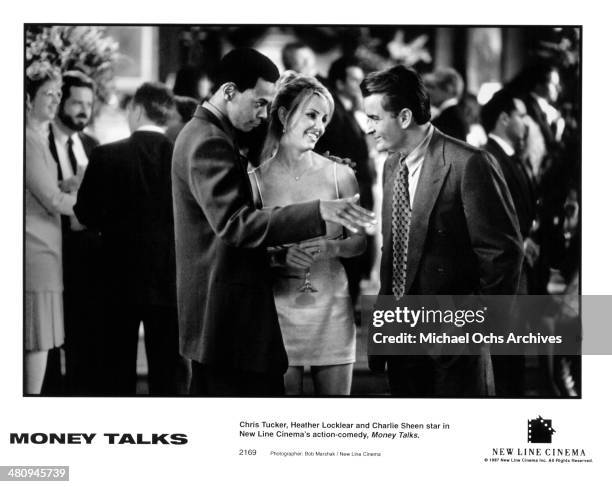 Actor Chris Tucker, actress Heather Locklear and actor Charlie Sheen in a scene from the movie "Money Talks " circa 1997.