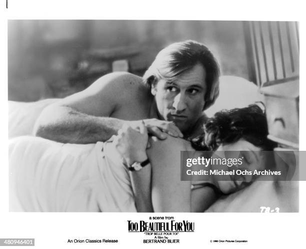 Actor Gerard Depardieu and actress Josiane Balasko in a scene from the Orion Classic movie " Too Beautiful for You" , circa 1989.