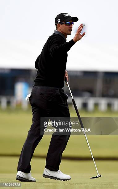 Adam Scott of Australia reacts after putting on the 17th green during the first round of the 144th Open Championship at The Old Course on July 16,...