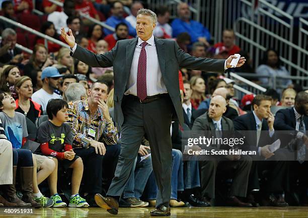 Head coach Brett Brown of the Philadelphia 76ers reacts to a play during the game against the Houston Rockets at the Toyota Center on March 27, 2014...