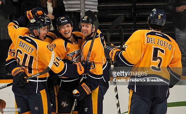 Victor Bartley, Nick Spaling and Michael Del Zotto of the Nashville Predators celebrate with teammate Colin Wilson on his goal against the Buffalo...