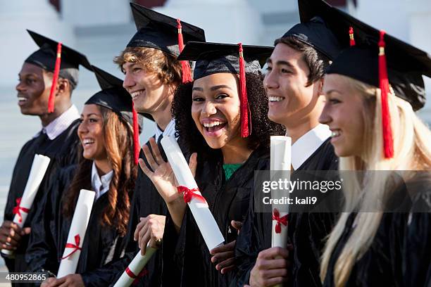 graduating class - black gown stock pictures, royalty-free photos & images