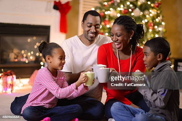 family gathered on christmas morning - black mug stock pictures, royalty-free photos & images