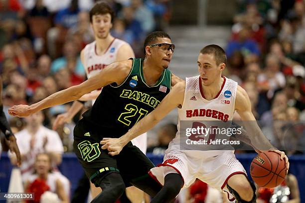 Josh Gasser of the Wisconsin Badgers against Isaiah Austin of the Baylor Bears in the second half during the regional semifinal of the 2014 NCAA...