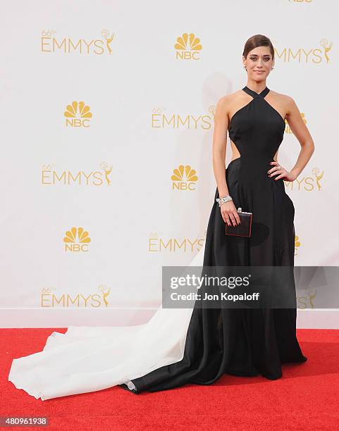 Actress Lizzy Caplan arrives at the 66th Annual Primetime Emmy Awards at Nokia Theatre L.A. Live on August 25, 2014 in Los Angeles, California.