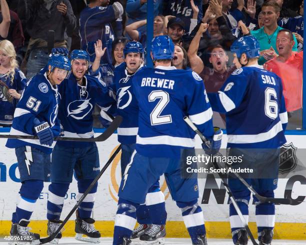 Ryan Callahan of the Tampa Bay Lightning celebrates his second goal of the game with Valtteri Filppula, Alex Killorn, and teammates during the third...