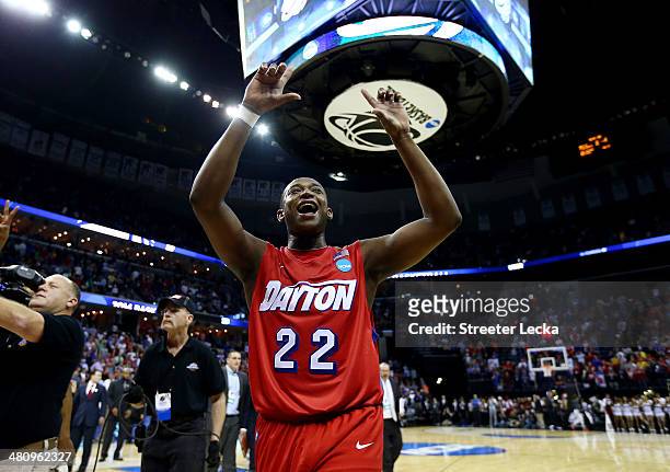 Kendall Pollard of the Dayton Flyers celebrates after defeating the Stanford Cardinal 82-72 in a regional semifinal of the 2014 NCAA Men's Basketball...