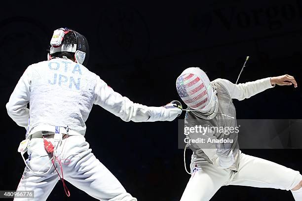 Yuki Ota of Japan competes with Alexander Massialas of United States during the Man's Senior Fleuret final match within the 2015 World Fencing...