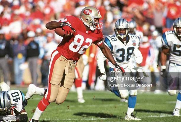 Wide Receiver John Taylor of the San Francisco 49ers runs with the ball against the Carolina Panthers during an NFL football game November 5, 1995 at...