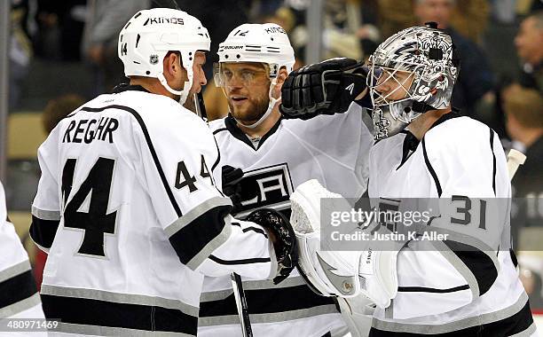 Martin Jones of the Los Angeles Kings celebrates with Robyn Regehr and Marian Gaborik after defeating the Pittsburgh Penguins at Consol Energy Center...