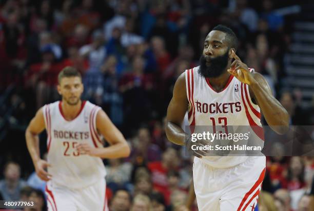 James Harden of the Houston Rockets celebrates a basket during the game against the Philadelphia 76ers at the Toyota Center on March 27, 2014 in...