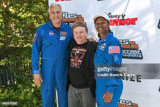 Astronaut Dr. Mike Massimino, founder of the International Space University Dr. Robert Richards and NASA astronaut Dr. Yvonne Cagle arrive for the...