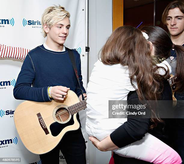 Actor/ singer Ross Lynch greets a fan at the SiriusXM Studios on March 27, 2014 in New York City.