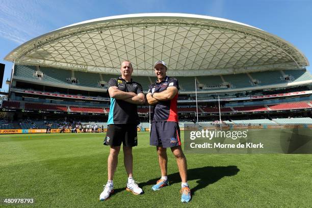 Ken Hinkley of Port Adelaide Power and Brenton Sanderson of the Adelaide Crows pose for a photograph after an AFL press conference at Adelaide Oval...