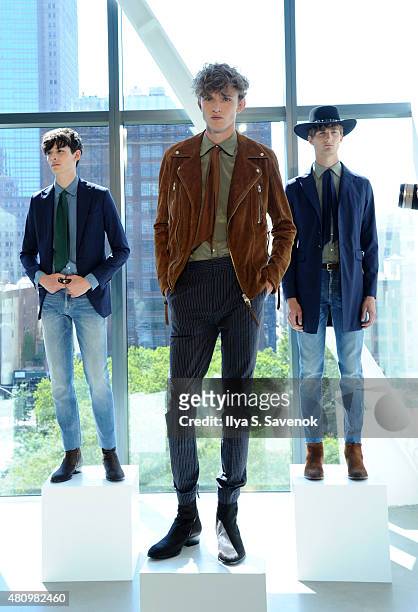 Models pose at the J. Lindeberg presentation during New York Fashion Week: Men's S/S 2016 at Spring Studios on July 16, 2015 in New York City.