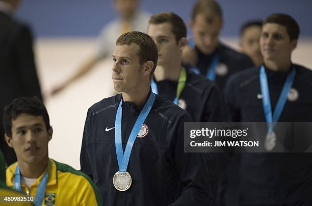 Darian Townsend of USA looks on with his teammates after they were awarded the silver medal in the Men's 4X200M Freestyle Relay finals at the 2015...