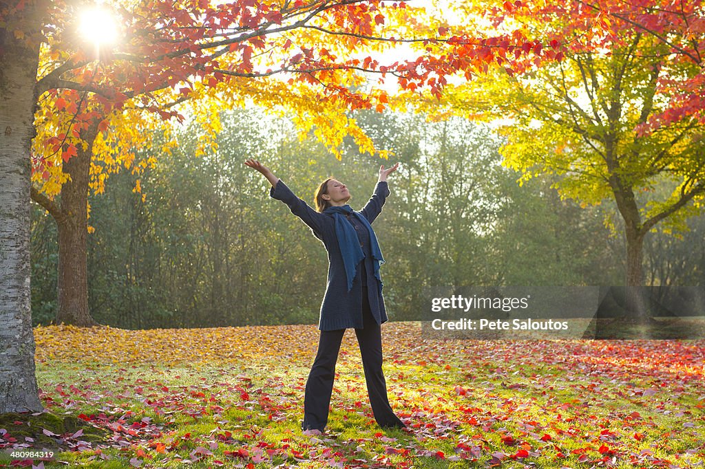 Woman stretching in forest