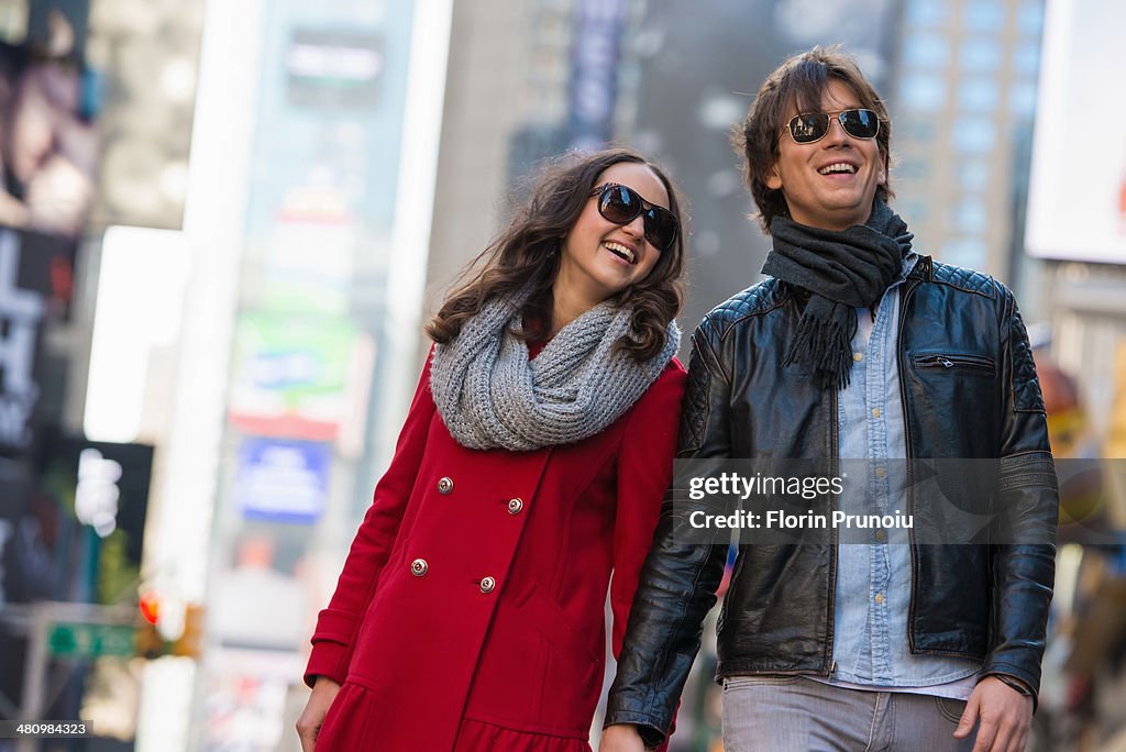 Young tourist couple holding hands, New York City, USA
