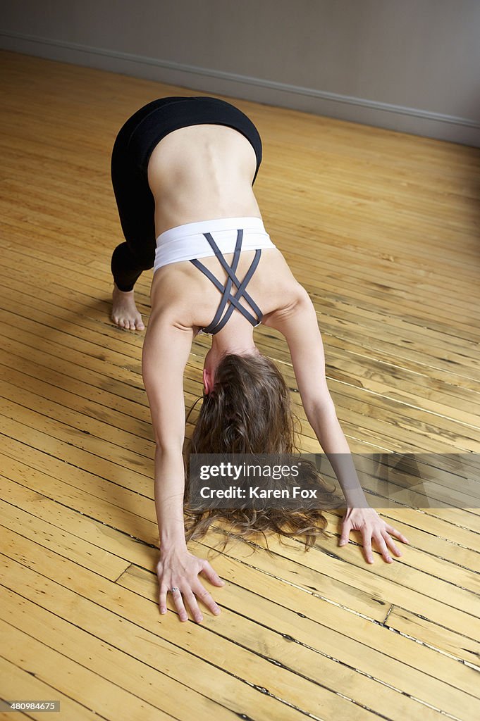 Woman doing downward facing dog pose