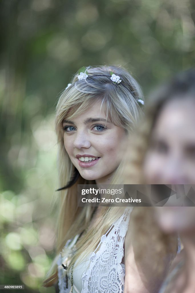 Two teenage girls in woodland