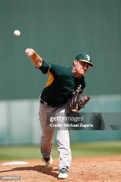 Philip Humber of the Oakland Athletics pitches during a spring training game against the Los Angeles Angels of Anaheim at Tempe Diablo Stadium on...