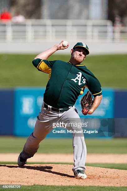 Philip Humber of the Oakland Athletics pitches during a spring training game against the Milwaukee Brewers at Maryvale Baseball Park on March 5, 2014...