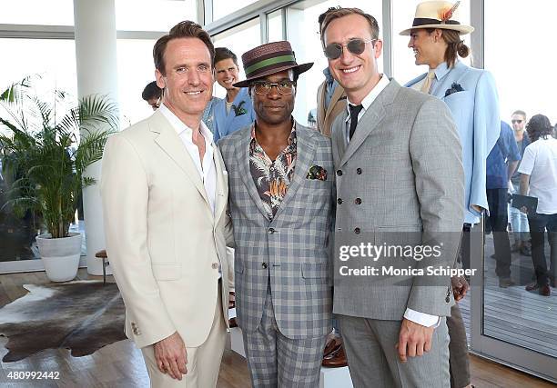 Hickey Freeman designer Arnold Brant Silverstone poses for a photo with Broadway actor Billy Porter and Adam Smith at the Hickey Freeman presentation...