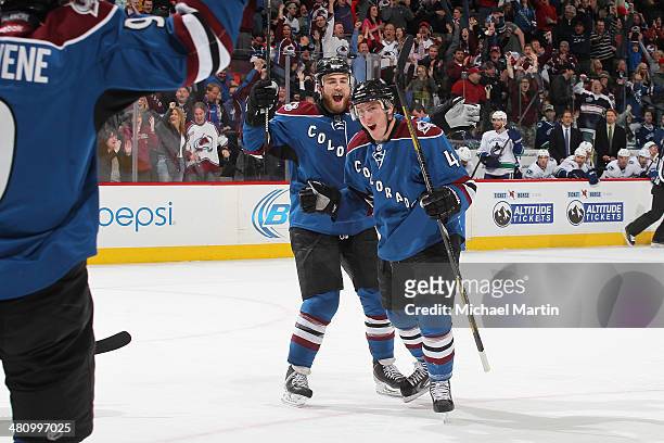 Tyson Barrie of the Colorado Avalanche celebrates after scoring the game winning goal against the Vancouver Canucks at the Pepsi Center on March 27,...