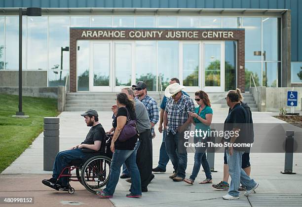 Shooting victim Caleb Medley leaevs the Arapahoe County Justice Center after a verdict was delivered in the trial of James Holmes on July 16, 2015 in...