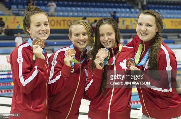 Bronze medalists Brittany MacLEan , Katerine Savard , Alyson Ackman and Emily Overholt of Canada celebrate after competing in the Women's 4X200M...