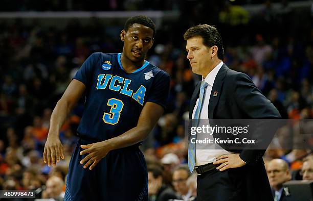 Head coach Steve Alford speaks with Jordan Adams of the UCLA Bruins during a regional semifinal of the 2014 NCAA Men's Basketball Tournament against...