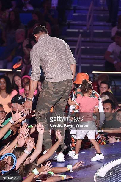Player Stephen Curry accepts the Best Male Athlete Award onstage with Riley Curry at the Nickelodeon Kids' Choice Sports Awards 2015 at UCLA's Pauley...