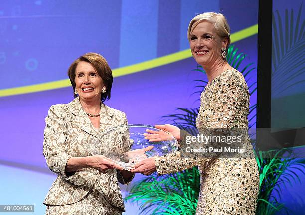 Planned Parenthood Federation of America President Cecile Richards presents U.S. House Minority Leader Rep. Nancy Pelosi with the Margaret Sanger...