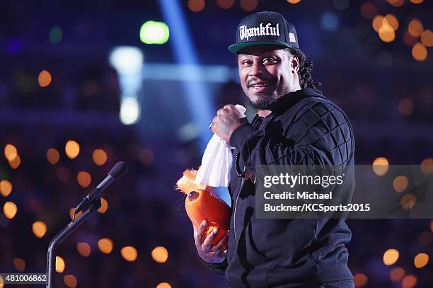 Player Marshawn Lynch accepts the Biggest Powerhouse award onstage at the Nickelodeon Kids' Choice Sports Awards 2015 at UCLA's Pauley Pavilion on...