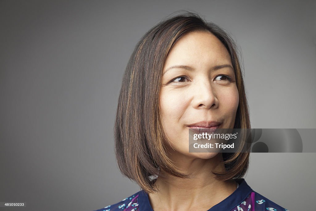 Woman looking off into distance, smiling