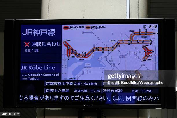 Digital screen at JR Station indicating the suspension of trains due to the heavy wind and rain delivered by typhoon Nangka on July 17, 2015 in...