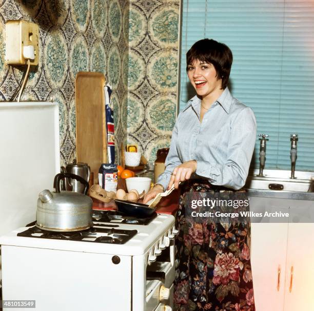 Portrait of Irish actress Gemma Craven in the kitchen, London, England, 1981.