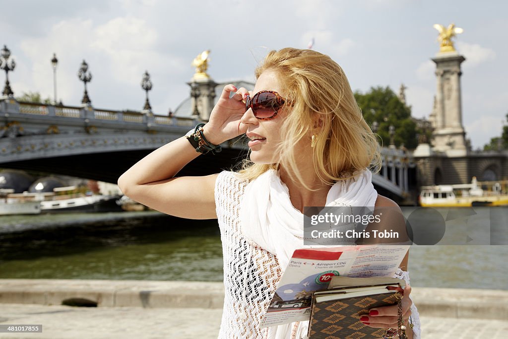 Woman in Paris with tourist map