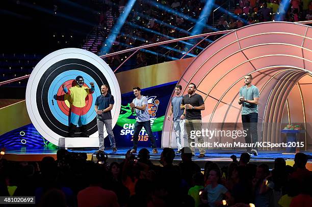 Host Russell Wilson prepares to be slimed onstage at the Nickelodeon Kids' Choice Sports Awards 2015 at UCLA's Pauley Pavilion on July 16, 2015 in...