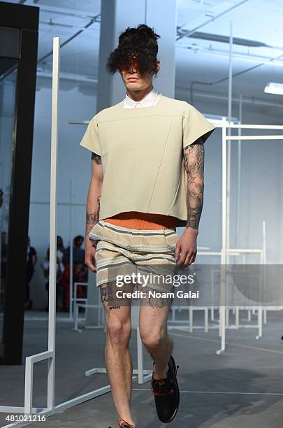 Model walks the runway at the Edmund Ooi fashion show during New York Fashion Week: Men's S/S 2016 on July 16, 2015 in New York City.