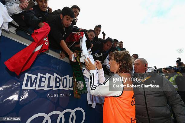 Luca Modric of Real Madrid signs autograohs during a Real Madrid training session at Melbourne Cricket Ground on July 17, 2015 in Melbourne,...