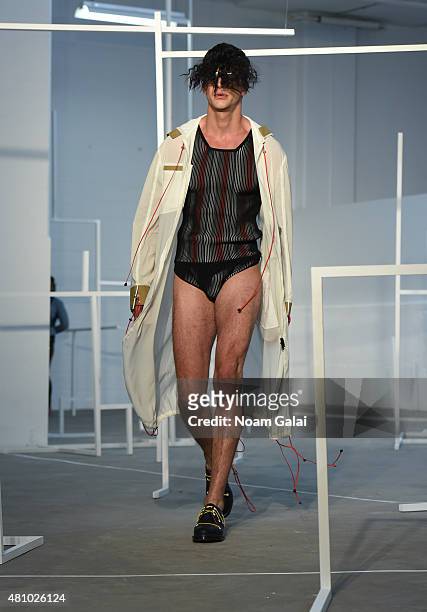 Model walks the runway at the Edmund Ooi fashion show during New York Fashion Week: Men's S/S 2016 on July 16, 2015 in New York City.