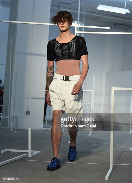 Model walks the runway at the Edmund Ooi fashion show during New York Fashion Week: Men's S/S 2016 on July 16, 2015 in New York City.