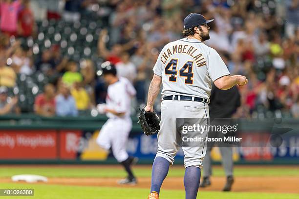 Relief pitcher Joba Chamberlain of the Detroit Tigers reacts as David Murphy of the Cleveland Indians rounds the bases after hitting a solo home run...