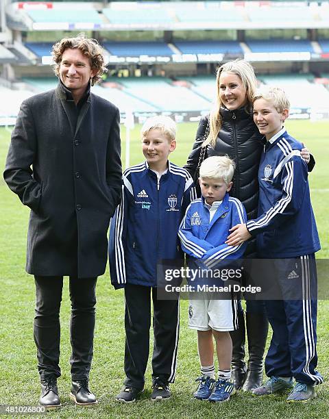 Essendon Bombers head coach James Hird and his wife Tania Hird are seen with their children during a Real Madrid training session at Melbourne...