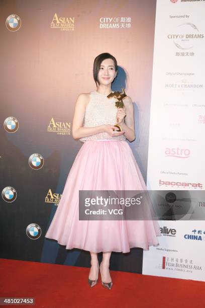 Maggie Jiang wins the Best newcomer of the 8th Asia Film Award on March 27, 2014 in Macau, China.