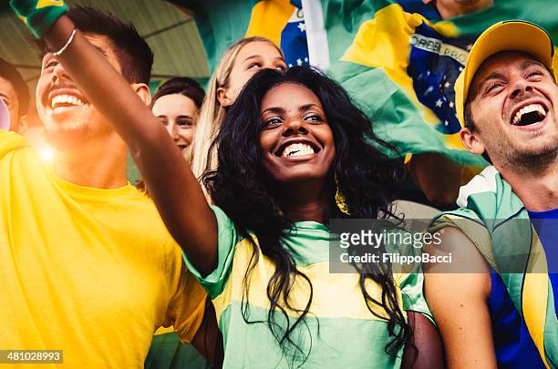 brazilian fans at stadium - vintage crowd cheering stock pictures, royalty-free photos & images